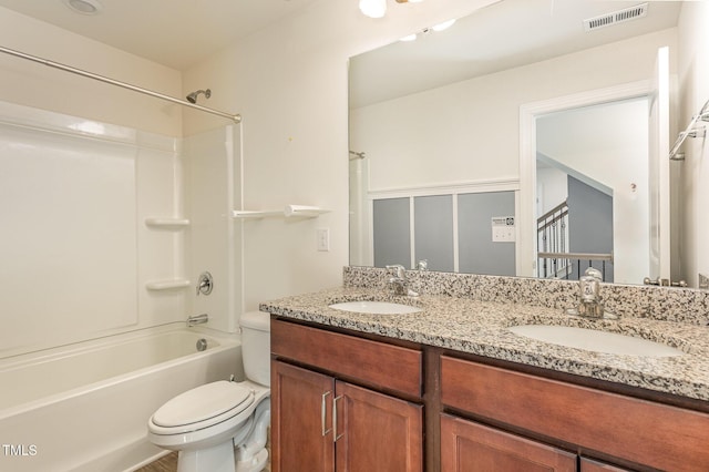 full bathroom featuring vanity, shower / bath combination, and toilet