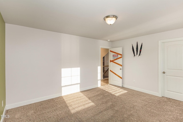 unfurnished room with carpet floors