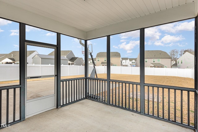 unfurnished sunroom featuring a wealth of natural light