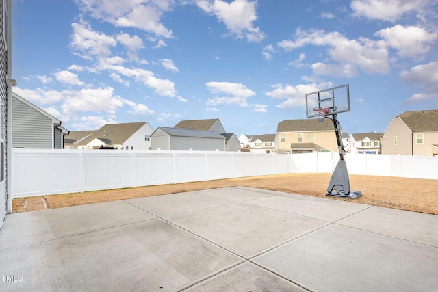 view of patio featuring basketball hoop