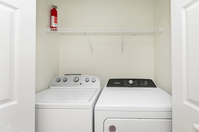 laundry area with independent washer and dryer