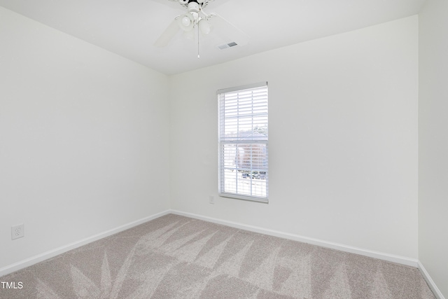 unfurnished room featuring ceiling fan and carpet flooring