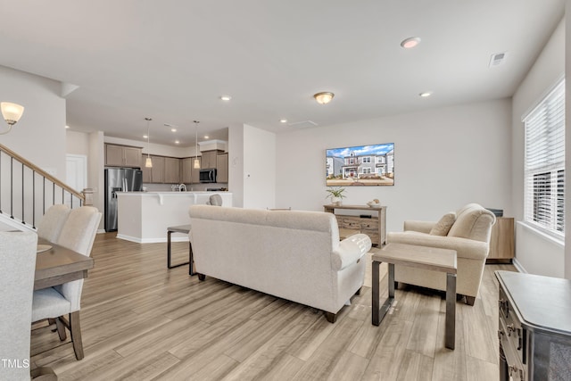 living room with light hardwood / wood-style floors