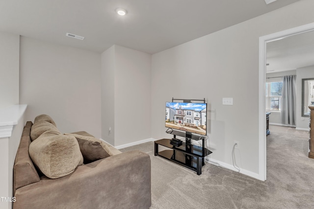 sitting room featuring light colored carpet