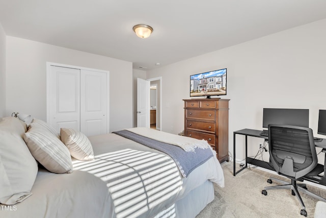 carpeted bedroom with a closet