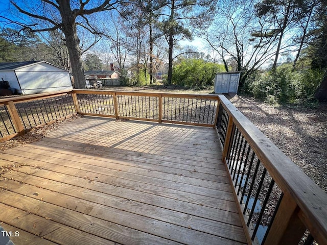 wooden deck featuring a storage shed