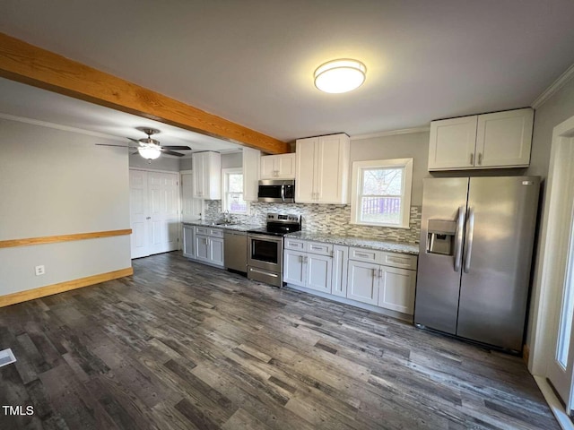 kitchen featuring white cabinets, ceiling fan, appliances with stainless steel finishes, tasteful backsplash, and beam ceiling