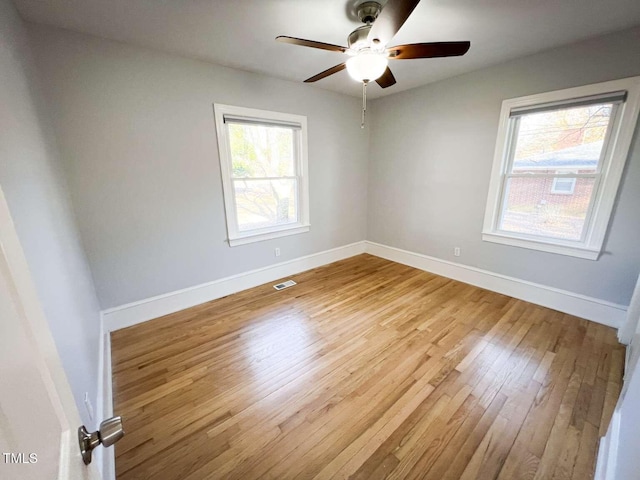 spare room with ceiling fan and light hardwood / wood-style floors