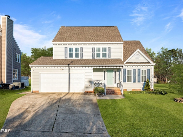 view of front of house with a garage and a front lawn