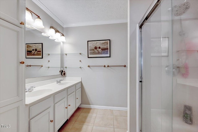 bathroom with a textured ceiling, ornamental molding, vanity, a shower with door, and tile patterned flooring