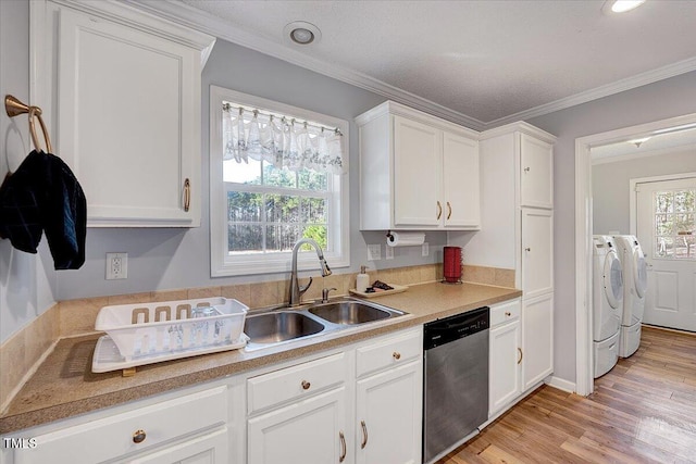 kitchen featuring dishwasher, washer and clothes dryer, and white cabinets