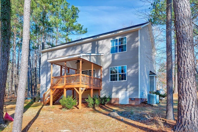 rear view of house featuring a wooden deck, ceiling fan, and central AC unit