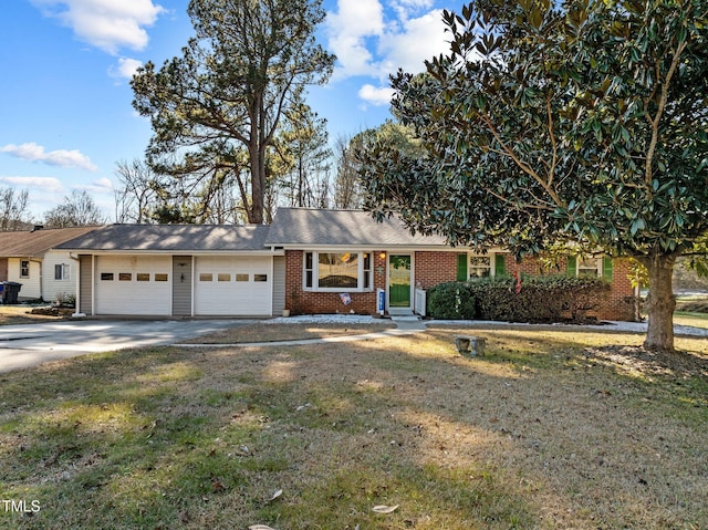 ranch-style home featuring a front lawn and a garage