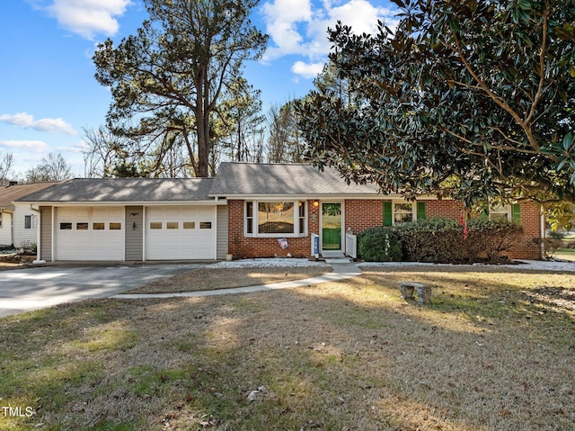 ranch-style house featuring a garage and a front lawn