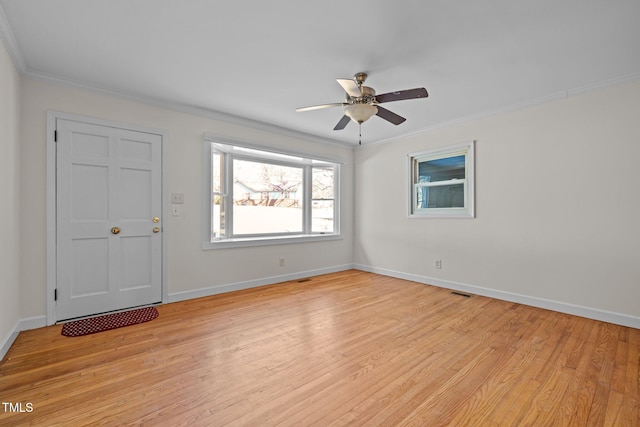 unfurnished room featuring ceiling fan, ornamental molding, and light hardwood / wood-style flooring