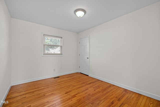 spare room featuring light hardwood / wood-style flooring