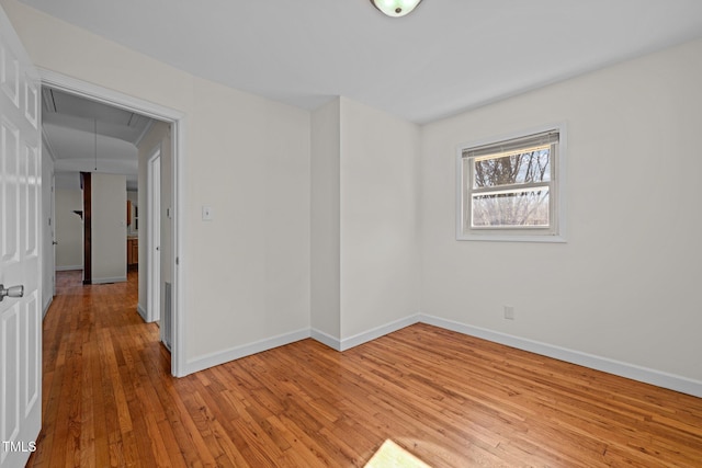 empty room with light hardwood / wood-style floors