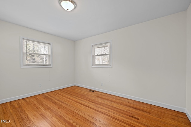 unfurnished room with light hardwood / wood-style flooring