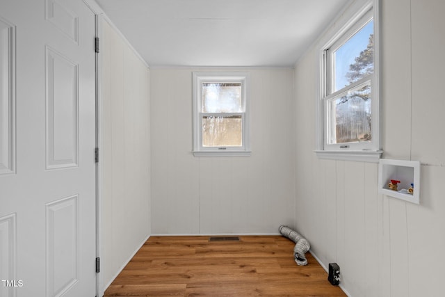 laundry room featuring light hardwood / wood-style floors and hookup for a washing machine