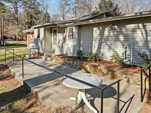 rear view of property featuring a patio