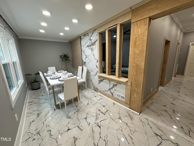 dining area with ornamental molding