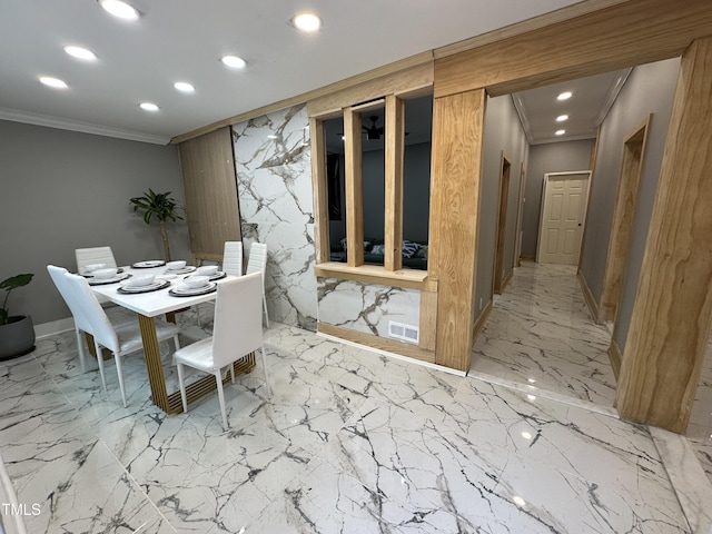 dining area with ornamental molding