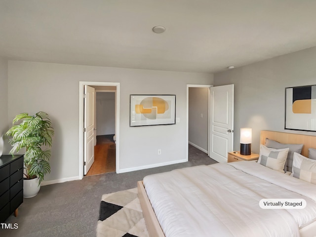 bedroom featuring dark colored carpet