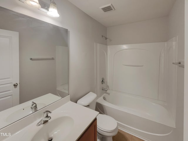 full bathroom with bathing tub / shower combination, tile patterned floors, vanity, and toilet