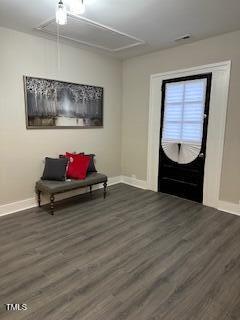 entryway with wood finished floors and baseboards