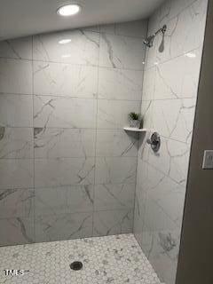 full bathroom with tiled shower