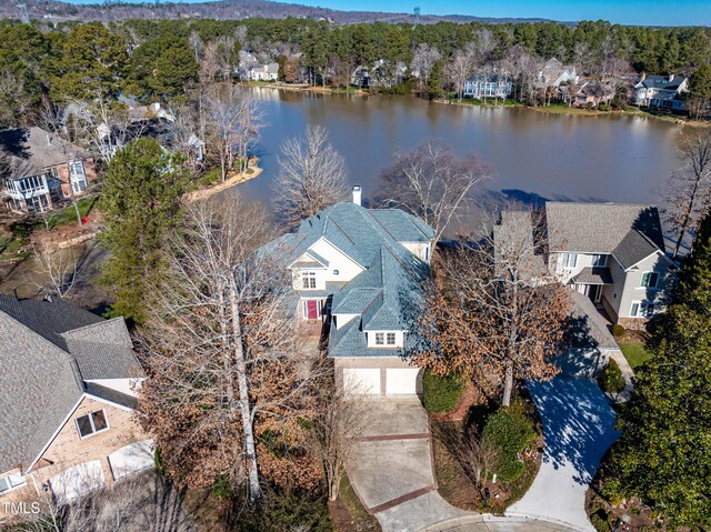 drone / aerial view featuring a residential view and a water view