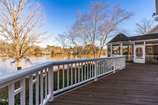 wooden deck with a water view