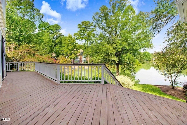 wooden deck featuring a water view