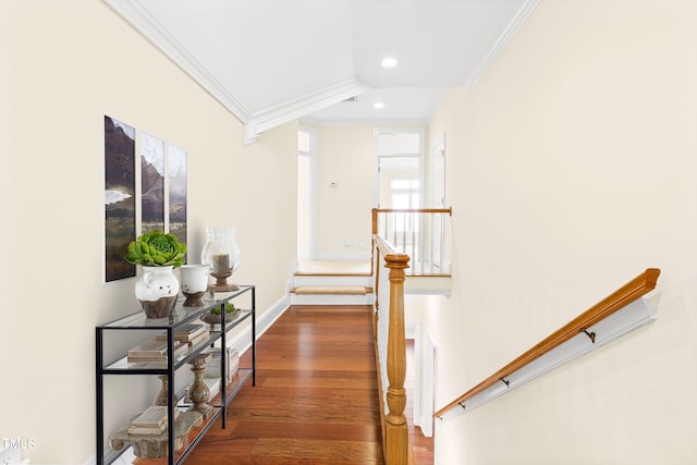 hallway with dark wood-type flooring, recessed lighting, crown molding, and baseboards