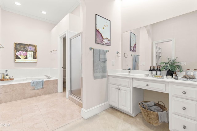 bathroom featuring toilet, vanity, a shower stall, a bath, and crown molding