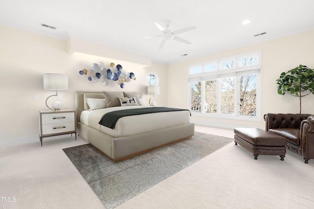 bedroom featuring light colored carpet, visible vents, and crown molding