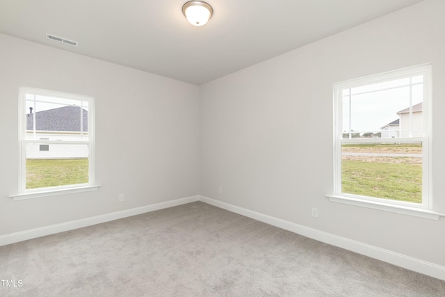 spare room with light colored carpet