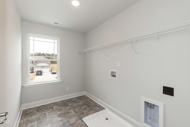 washroom featuring hookup for an electric dryer and hookup for a washing machine