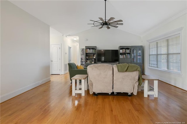 living room with ceiling fan, wood-type flooring, and lofted ceiling