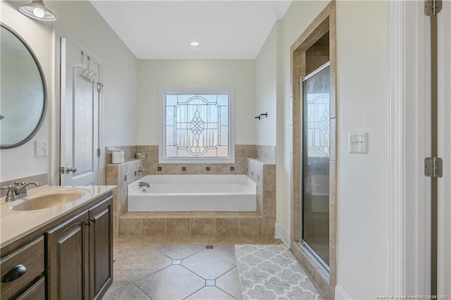 bathroom featuring tile patterned flooring, shower with separate bathtub, and vanity