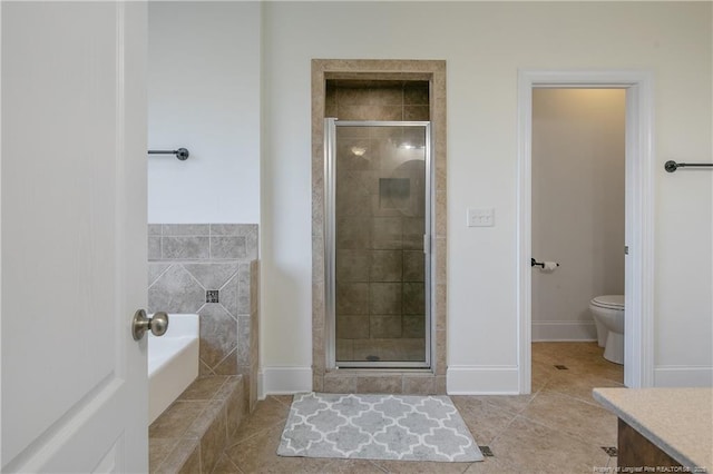 full bathroom featuring tile patterned flooring, vanity, toilet, and independent shower and bath