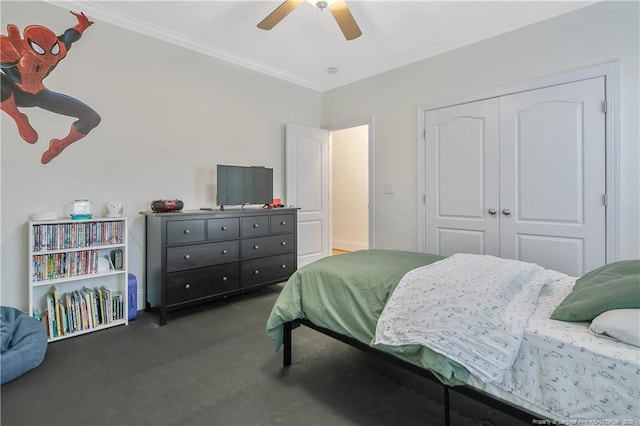 bedroom featuring dark colored carpet, a closet, ceiling fan, and ornamental molding