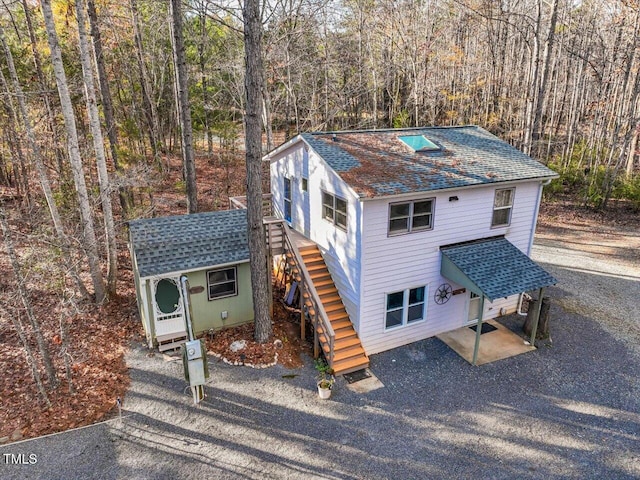 view of front property with an outbuilding