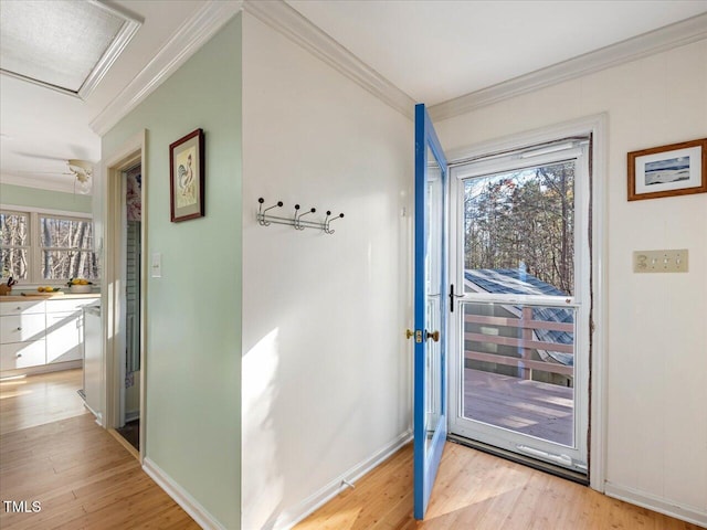 doorway with crown molding and light wood-type flooring