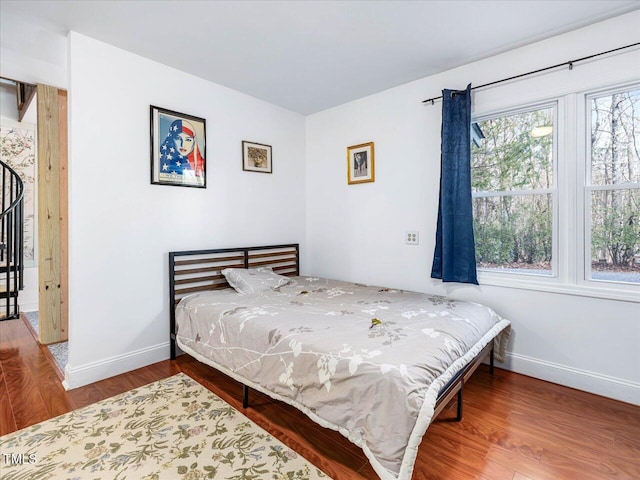 bedroom with wood-type flooring