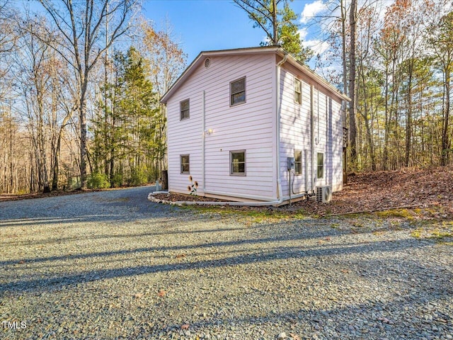 view of side of property with cooling unit