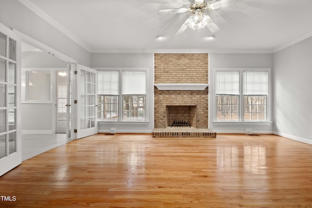 unfurnished living room with a fireplace, plenty of natural light, ornamental molding, and ceiling fan