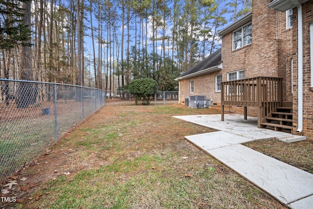 view of yard with cooling unit and a wooden deck