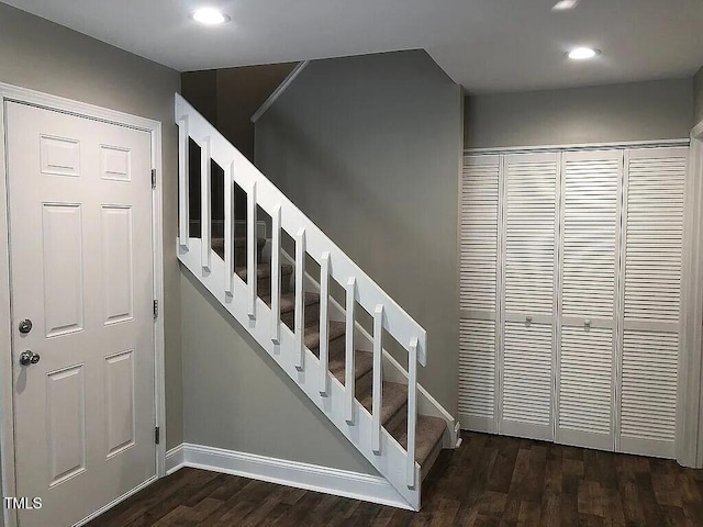 stairway with hardwood / wood-style flooring