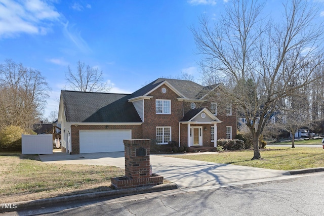 view of front of house featuring a front lawn and a garage